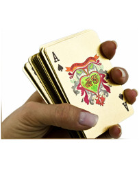 Gold plastic playing cards in a decorative casket